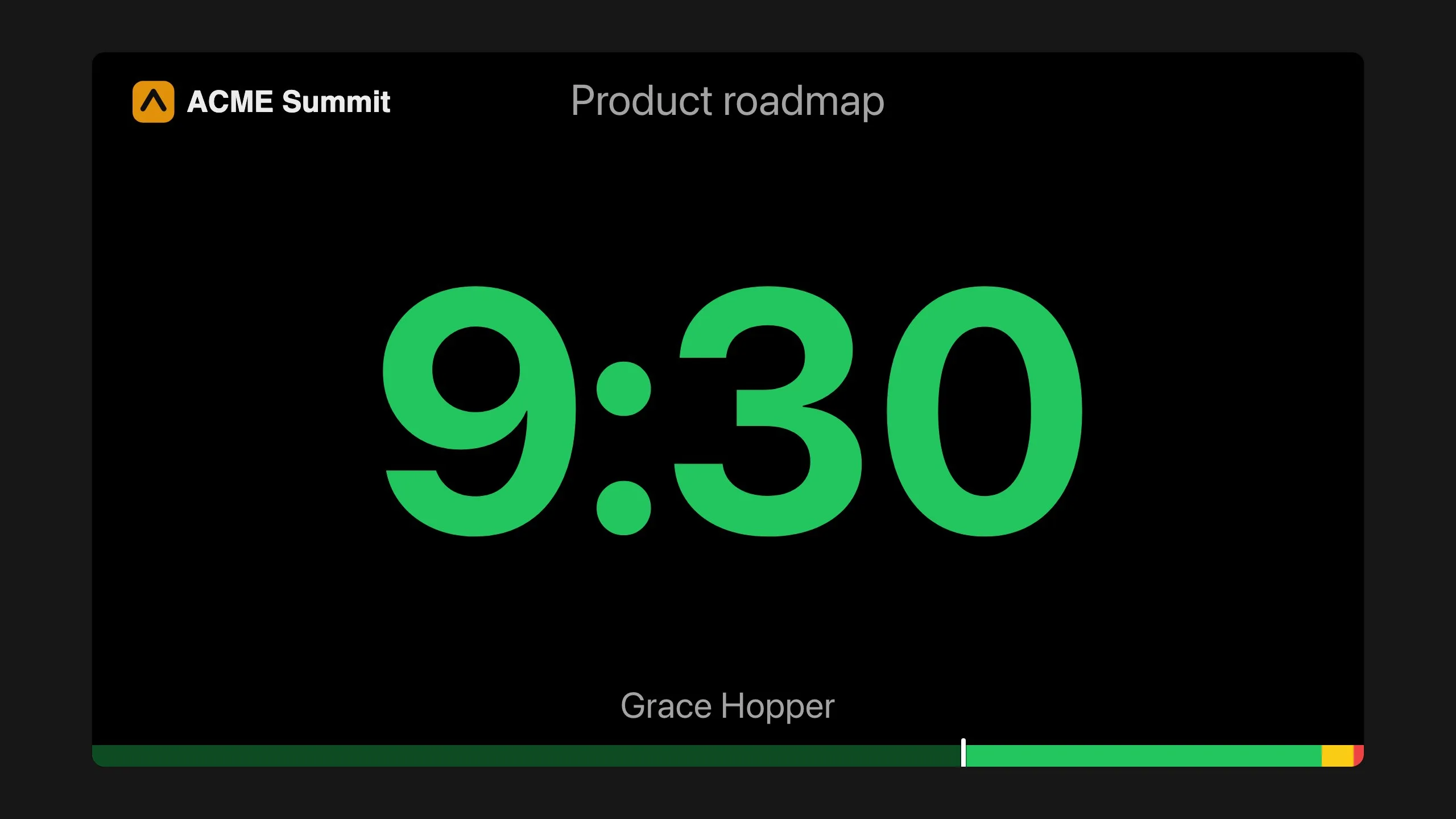 A speaker's screen with the ACME Summit logo in the corner above the countdown.